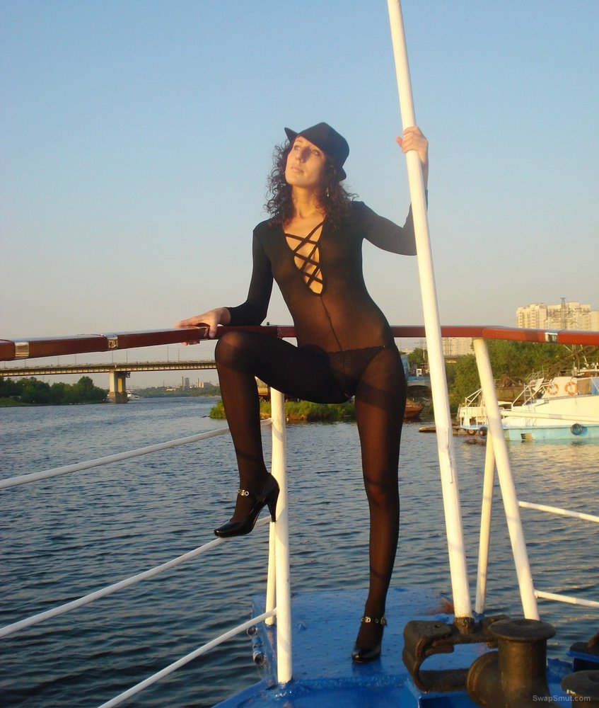 Friends Sexy Wife Posing On A Boat While On Holiday Wearing A Catsuit